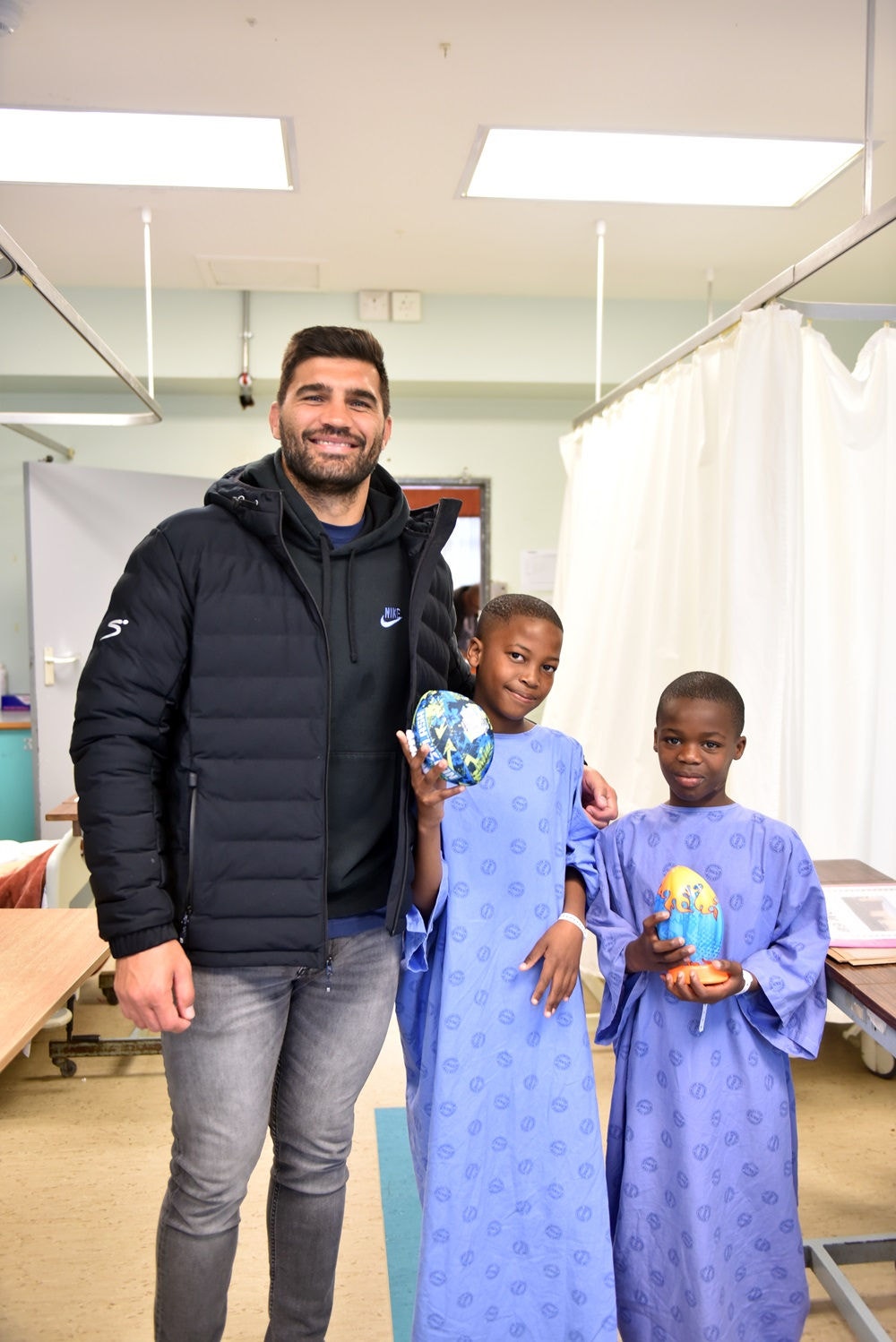 Damian De Allende with patients from Smile organisation
